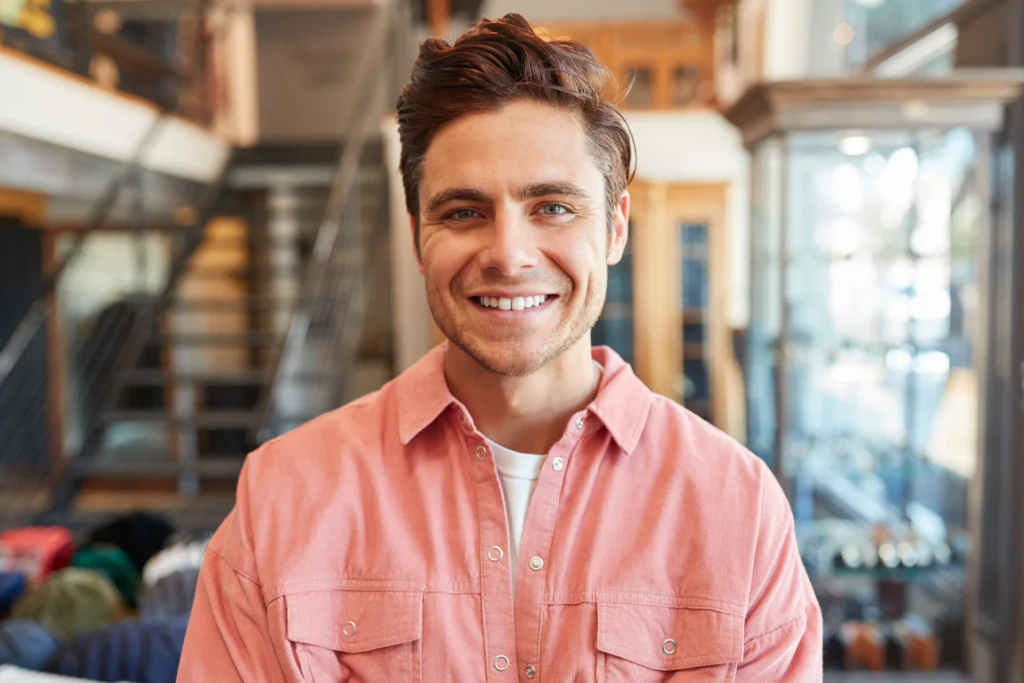 portrait-of-smiling-male-owner-of-fashion-store-st-